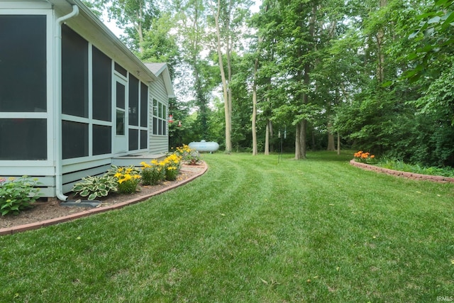 3 Cobblestone Ct, Delphi, IN 49623 - view of green lawn featuring a sunroom