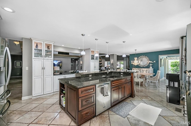 51257 Blue Ribbon Ln, Elkhart, IN 46514 - kitchen with appliances with stainless steel finishes, glass insert cabinets, a kitchen island with sink, white cabinets, and dark stone countertops
