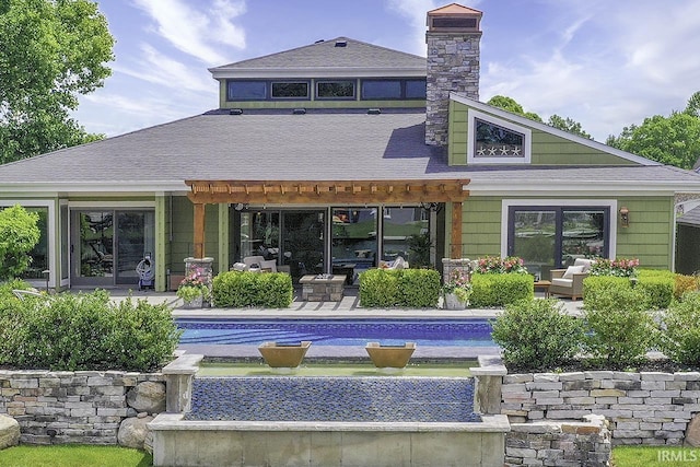 51257 Blue Ribbon Ln, Elkhart, IN 46514 - rear view of house with a chimney, an outdoor pool, and roof with shingles