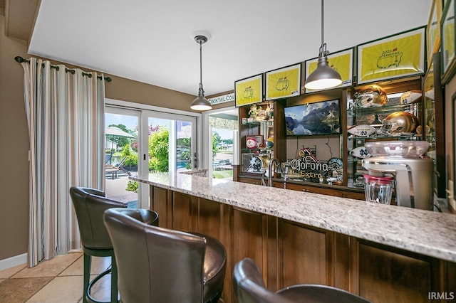 51257 Blue Ribbon Ln, Elkhart, IN 46514 - bar featuring hanging light fixtures and light tile patterned flooring