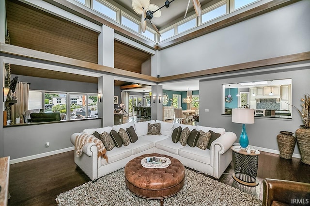51257 Blue Ribbon Ln, Elkhart, IN 46514 - living room featuring a chandelier, wood finished floors, healthy amount of natural light, and a towering ceiling