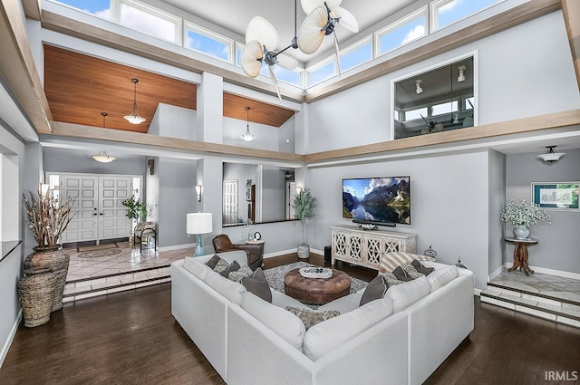 51257 Blue Ribbon Ln, Elkhart, IN 46514 - living area featuring a towering ceiling, wood finished floors, and a chandelier