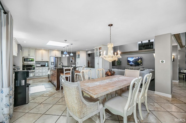 51257 Blue Ribbon Ln, Elkhart, IN 46514 - dining space with a chandelier, a skylight, and recessed lighting
