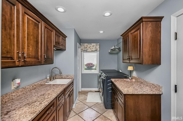 51257 Blue Ribbon Ln, Elkhart, IN 46514 - laundry area with washer and dryer, cabinet space, light tile patterned floors, and recessed lighting