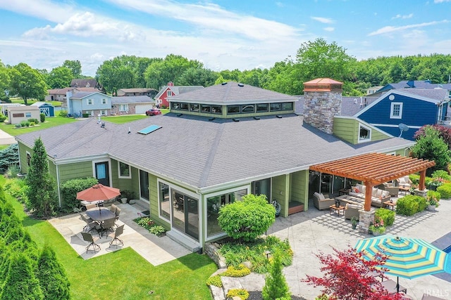 51257 Blue Ribbon Ln, Elkhart, IN 46514 - back of property featuring a patio area, a pergola, a shingled roof, a chimney, and a residential view