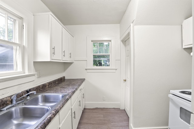 407 W Branning Ave, Fort Wayne, IN 46807 - kitchen featuring white range with electric stovetop, wood finished floors, white cabinetry, and dark countertops