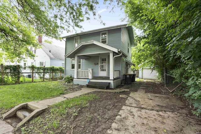 407 W Branning Ave, Fort Wayne, IN 46807 - view of front of property featuring covered porch, an outbuilding, and a garage