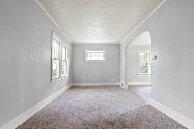 407 W Branning Ave, Fort Wayne, IN 46807 - unfurnished room with ornamental molding, arched walkways, and carpet flooring