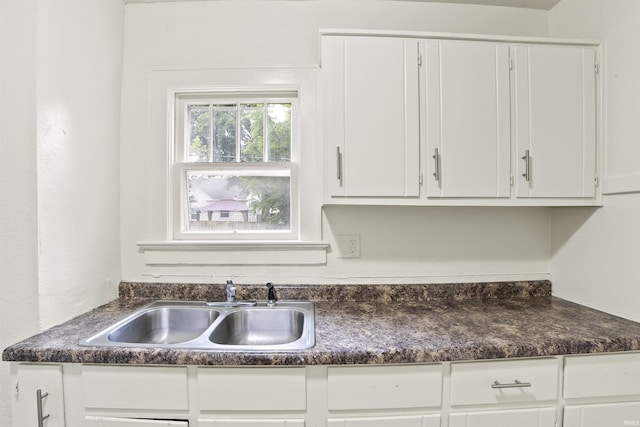 407 W Branning Ave, Fort Wayne, IN 46807 - kitchen with dark countertops and white cabinetry