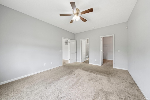 13233 Mera Cv, Fort Wayne, IN 46814 - unfurnished bedroom with a spacious closet, carpet, a closet, ceiling fan, and connected bathroom