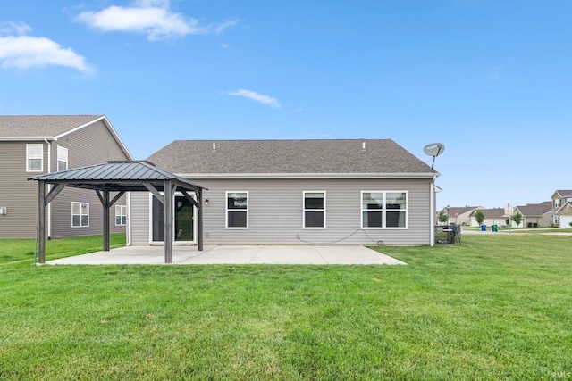 13233 Mera Cv, Fort Wayne, IN 46814 - back of property featuring a patio area, a gazebo, a lawn, and a shingled roof