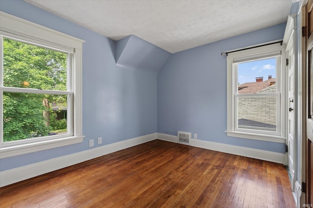 1060 Woodward Ave, South Bend, IN 46616 - bonus room featuring dark wood-style floors and a textured ceiling