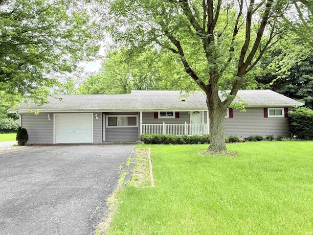 806 N Tippy Dr, Marion, IN 46952 - ranch-style house featuring an attached garage, driveway, and a front lawn
