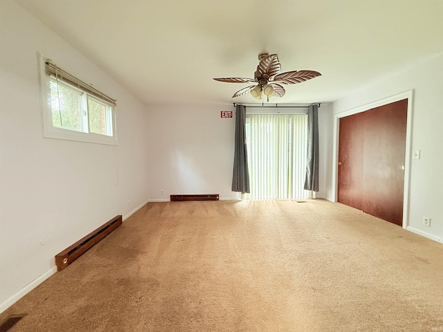 806 N Tippy Dr, Marion, IN 46952 - unfurnished room with a baseboard radiator, carpet flooring, and a ceiling fan