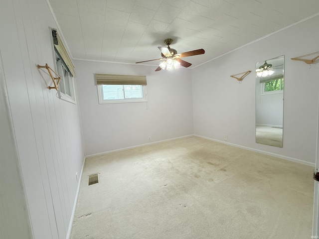 806 N Tippy Dr, Marion, IN 46952 - empty room featuring crown molding, carpet, and a ceiling fan