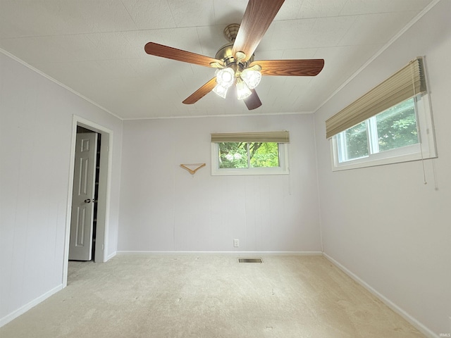 806 N Tippy Dr, Marion, IN 46952 - empty room featuring carpet, crown molding, and ceiling fan