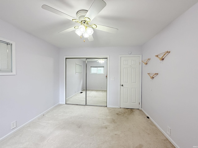 806 N Tippy Dr, Marion, IN 46952 - unfurnished bedroom featuring carpet, a closet, and ceiling fan