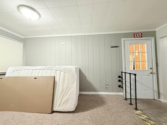 806 N Tippy Dr, Marion, IN 46952 - carpeted bedroom featuring crown molding and wooden walls