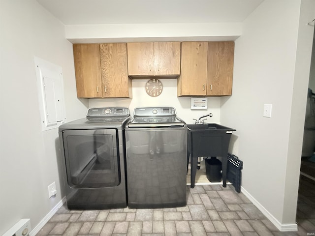 806 N Tippy Dr, Marion, IN 46952 - laundry room featuring cabinet space, electric panel, independent washer and dryer, and brick patterned flooring