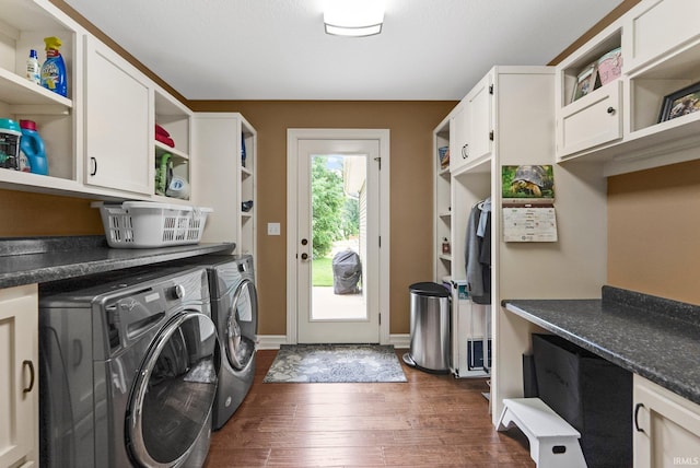 1176 W Whitetail Dr, Columbia City, IN 46725 - washroom featuring washing machine and clothes dryer, cabinet space, and dark wood finished floors