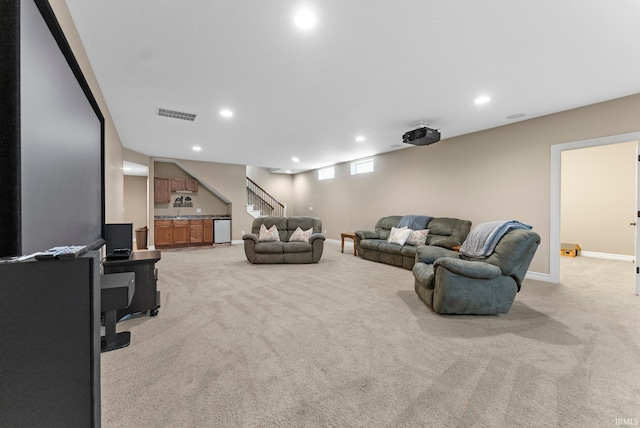 1176 W Whitetail Dr, Columbia City, IN 46725 - living room featuring light carpet, stairway, recessed lighting, and bar