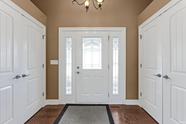 1176 W Whitetail Dr, Columbia City, IN 46725 - entrance foyer with a chandelier and dark wood-style flooring