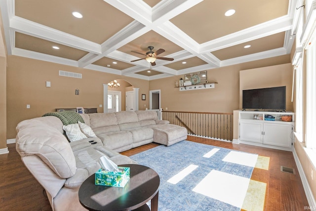 1176 W Whitetail Dr, Columbia City, IN 46725 - living area featuring arched walkways, coffered ceiling, wood finished floors, beam ceiling, and ceiling fan