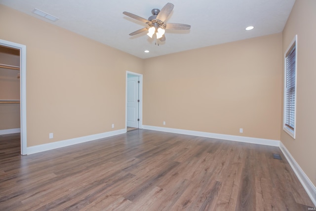 15442 Aj Dr, Evansville, IN 47725 - unfurnished bedroom featuring wood finished floors, recessed lighting, a walk in closet, and ceiling fan