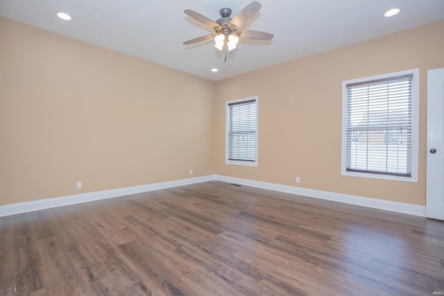 15442 Aj Dr, Evansville, IN 47725 - empty room with healthy amount of natural light, a ceiling fan, dark wood-style floors, and recessed lighting