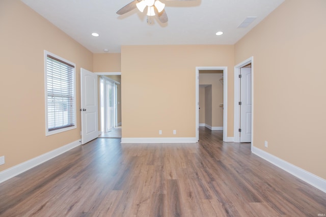15442 Aj Dr, Evansville, IN 47725 - empty room featuring a ceiling fan, wood finished floors, and recessed lighting