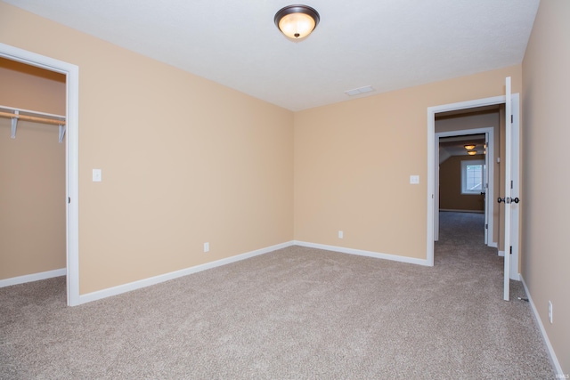15442 Aj Dr, Evansville, IN 47725 - unfurnished bedroom with carpet flooring, a closet, and a walk in closet
