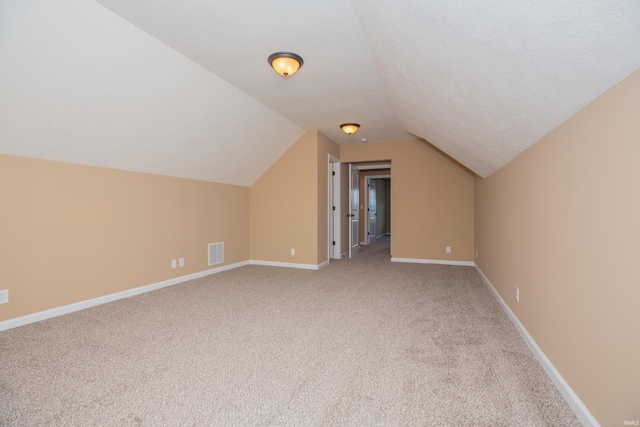 15442 Aj Dr, Evansville, IN 47725 - additional living space with light colored carpet and lofted ceiling