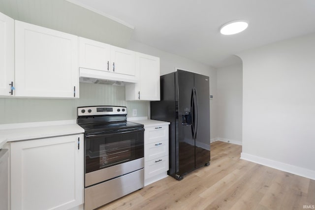 2318 Dodge Ave, Fort Wayne, IN 46805 - kitchen with stainless steel electric range oven, under cabinet range hood, black fridge, white cabinets, and light countertops