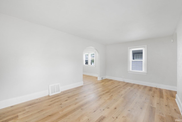 2318 Dodge Ave, Fort Wayne, IN 46805 - spare room with arched walkways and light wood finished floors