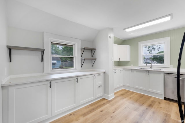 2318 Dodge Ave, Fort Wayne, IN 46805 - kitchen with open shelves, dishwasher, white cabinetry, light wood finished floors, and light countertops