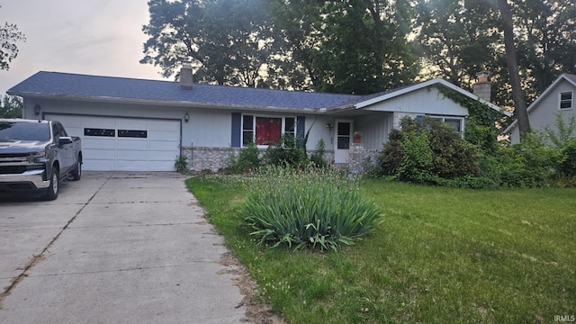 50859 Oak Tree Ln, Bristol, IN 46507 - ranch-style home featuring a garage, driveway, a front yard, a chimney, and brick siding