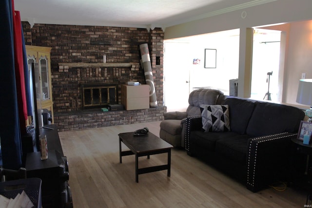 50859 Oak Tree Ln, Bristol, IN 46507 - living room featuring wood finished floors, a fireplace, ornamental molding, and brick wall