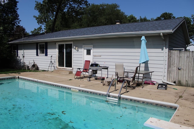 50859 Oak Tree Ln, Bristol, IN 46507 - rear view of house featuring a patio area and roof with shingles