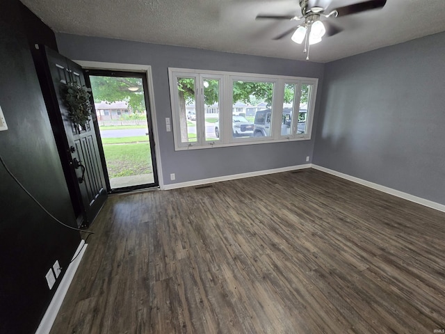 614 N Lancelot Dr, Marion, IN 46952 - spare room featuring dark wood finished floors and a ceiling fan