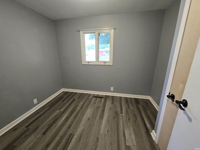 614 N Lancelot Dr, Marion, IN 46952 - empty room featuring dark wood-type flooring