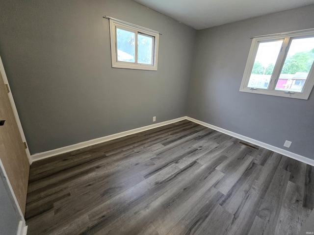 614 N Lancelot Dr, Marion, IN 46952 - unfurnished room with plenty of natural light and dark wood-style flooring