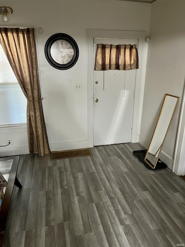 731 Johnson St, South Bend, IN 46628 - unfurnished dining area featuring wood finished floors and baseboards