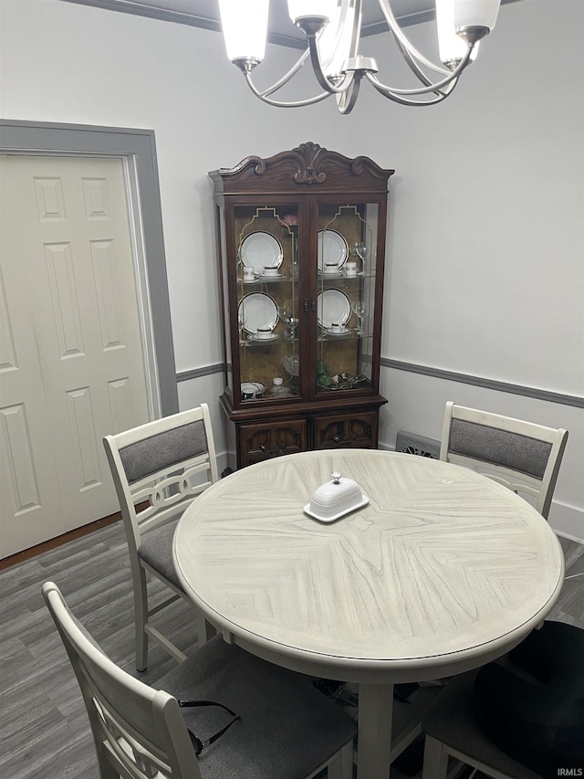 731 Johnson St, South Bend, IN 46628 - dining room with a chandelier and wood finished floors