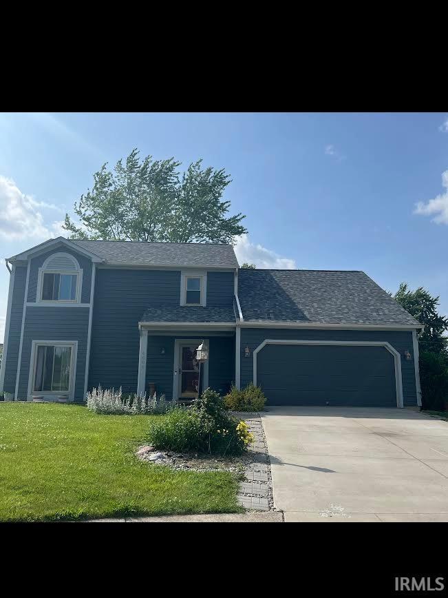 6804 Richfield Ct, Fort Wayne, IN 46816 - view of front of home featuring a garage, driveway, a front lawn, and roof with shingles