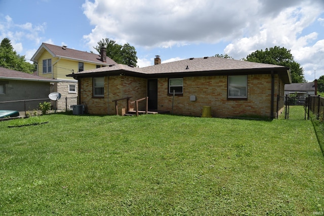 2726 S Roena St, Indianapolis, IN 46241 - rear view of property featuring a gate, brick siding, and a chimney