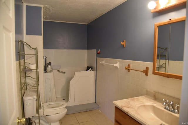 2726 S Roena St, Indianapolis, IN 46241 - full bath with a textured ceiling, vanity, tile patterned floors, tile walls, and a wainscoted wall