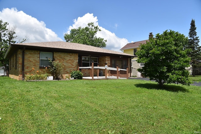 2726 S Roena St, Indianapolis, IN 46241 - rear view of house with a lawn and brick siding