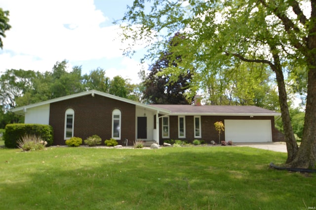 53120 Fox Ct, South Bend, IN 46637 - single story home featuring a garage, a front lawn, brick siding, and concrete driveway