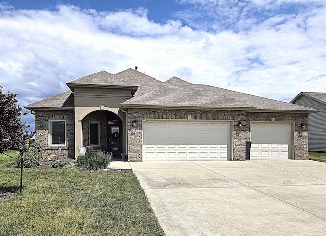 3520 Lintel Dr, West Lafayette, IN 47906 - french country style house with driveway, a garage, and brick siding