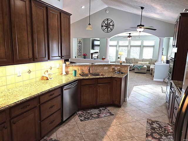 3520 Lintel Dr, West Lafayette, IN 47906 - kitchen with decorative columns, appliances with stainless steel finishes, a ceiling fan, a peninsula, and decorative backsplash